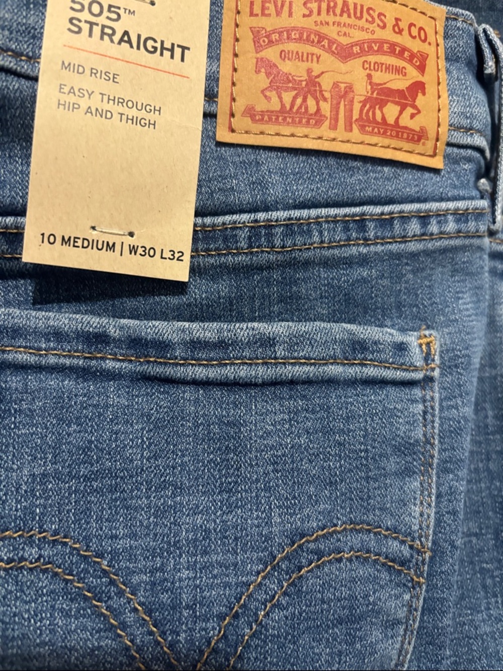 Levi's Women's Straight Leg Jeans in Medium Blue with Tan Stitching